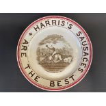 A Harris's Sausages circular plate,with central scene depicting a man astride a pig 'The Winner of