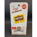 A vending machine for Bayer aspirin, 8 3/4" w x 17 1/2" h x 5 3/4" d.