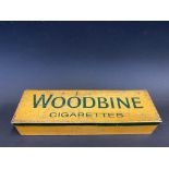 A Woodbine Dominoes tin with full set inside of ususual back design.