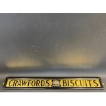 A Crawford's Biscuits glass advertising sign with central coat of arms, set within wooden frame,