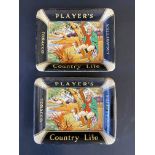 A pair of rectangular ashtrays advertising Player's Country Life Cigarettes.