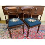 A pair of good quality William IV mahogany dining chairs with drop-in needlework covered seats.
