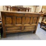 An early 19th Century oak coffer with a plain lid and fielded panel front, 47" w.