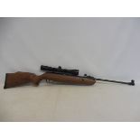 An SMK 19 air rifle with a walnut stock, fitted with a Hawke sport HD 3-9 x 40 mil OOT,