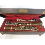 A Commodore clarinet with white metal keys, number 42797, in a fitted case.