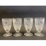A set of four 19th Century Continental glasses, each etched with a stag in a forest landscape