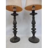 A pair of Kashmir style candlesticks, with baluster columns, decorated with gilt foliage on a