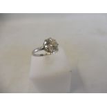 A very good solitaire diamond of large size, approx. 8mm across, set within