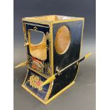 A black lacquer model of a sedan chair, to the back Marcovitch Sedan Cabinet, 6" high (lacks l