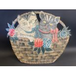 A toleware fire screen in the form of two cats in a basket of flowers, 28" wide.