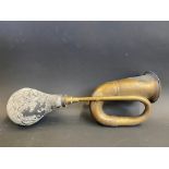 A brass car horn.