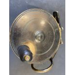 A Malloch Patent brass 3 7/8" side caster fishing reel.