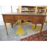 A late 19th Century mahogany writing table with a leather panel top above three frieze drawers,