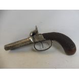 A mid 19th Century 50 bore double barrel percussion pistol, the action with scrolling foliate
