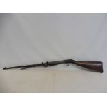 A BSA air rifle with a plain barrel and walnut stock, number 21735, 43 1/2" long overall.