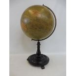 A Phillips 12" terrestrial globe on an ebonised base, 21" h overall.