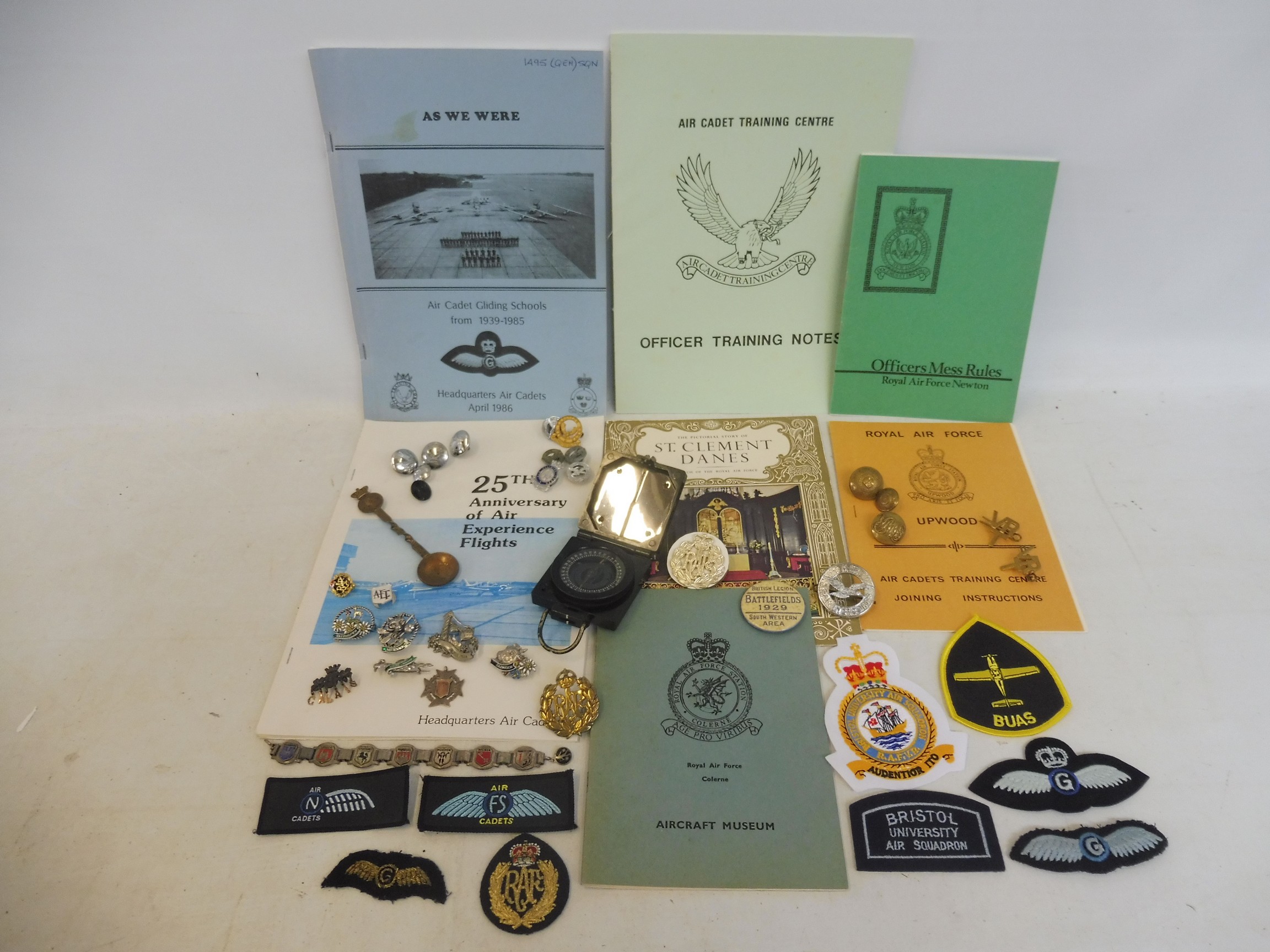 A collection of interesting RAF badges and insignia, military ephemera, a compass plus