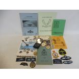 A collection of interesting RAF badges and insignia, military ephemera, a compass plus
