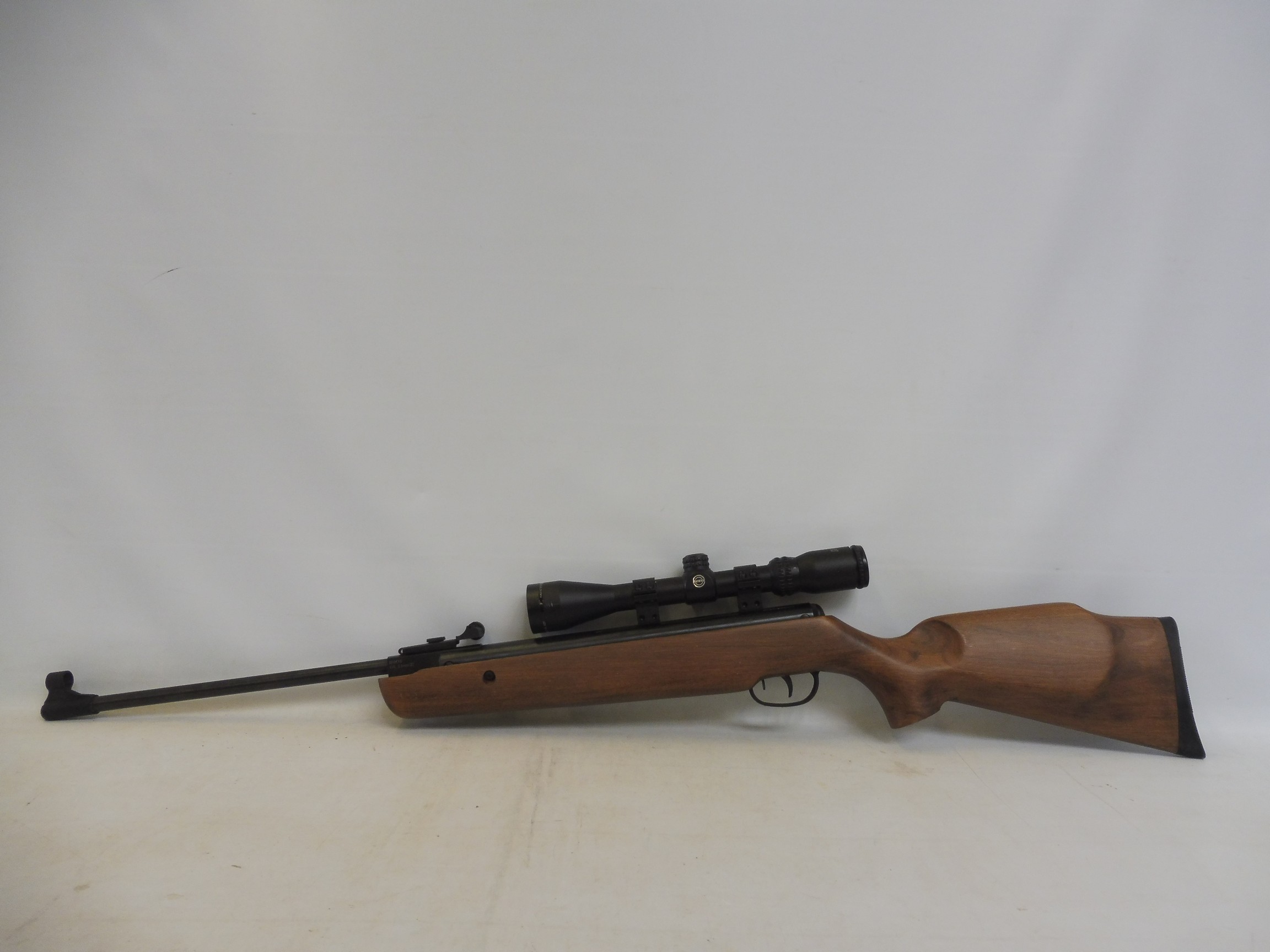An SMK 19 air rifle with a walnut stock, fitted with a Hawke sport HD 3-9 x 40 mil OOT, - Image 4 of 4
