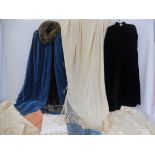 A small collection of vintage costume and textiles, including two capes, a fringed stole and