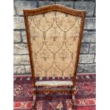 A 19th Century kingwood and tulipwood fire screen, probably French, with an upholstered
