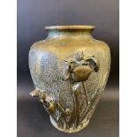 A large bronze bulbous vase in the Art Nouveau taste, with two sprays of iris, 18 1/2" high.