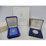 A cased 1976 150 balboa platinum coin of Panama, with certificate and booklet plus a 1982 100 lei