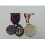 A National Rifle Club oval medal and one other attached to a striped ribbon with date bar for 1916