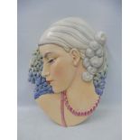 A Beswick Art Deco style brightly coloured wall plaque of a lady in side profile, 23 x 31cm,