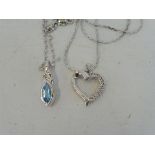 A Swiss blue topaz and silver pendant on a silver chain and a diamond and silver heart shaped