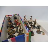 A collection of fourteen die-cast metal figures, all of soldiers from various countries and