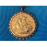 A 1980 gold sovereign in a gold mount hanging on a gold chain, overall weight approx. 13g.
