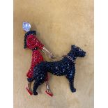 A Butler & Wilson Lady and Dog brooch in Art Deco style, with Swarovski crystals, h 10cm, w 8cm