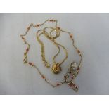 A good locket depicting the Virgin Mary on a 9ct gold chain, approx 8.3g overall plus a 9ct gold and