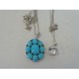 A Sleeping Beauty turquoise and possibly sapphire silver pendant on a silver chain and a quartz