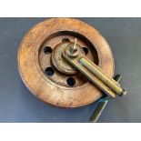 A Pownall's Drag Oilin Patent no. 361767 5" wooden centre pin reel.