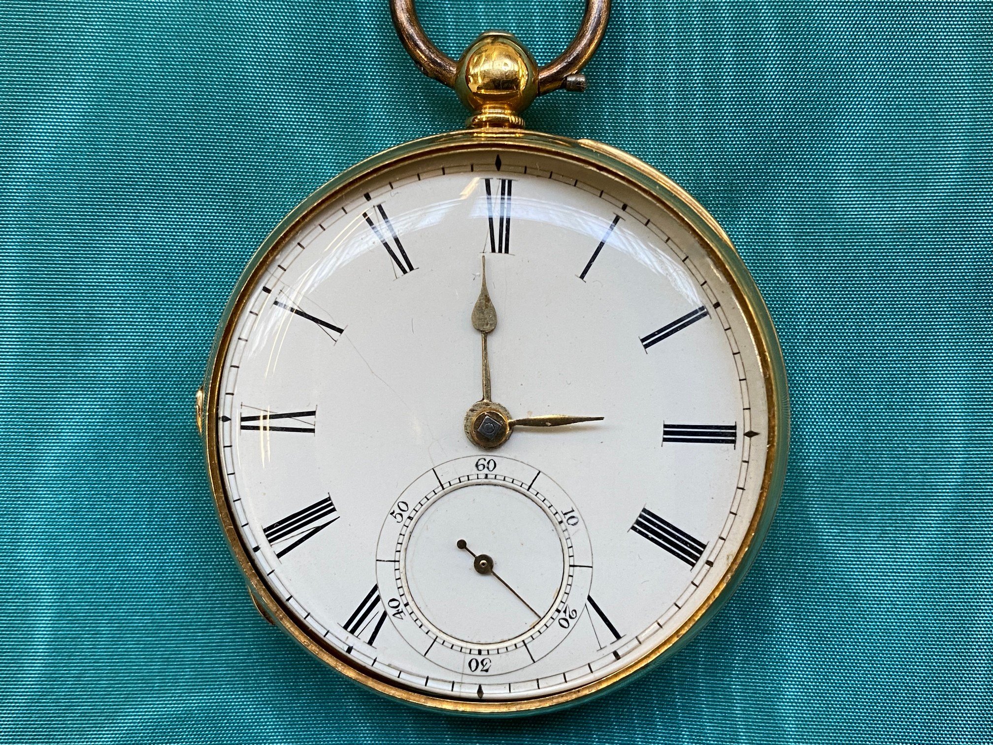 An 18ct gold pocket watch with secondary dial, overall weight approx. 78.9g, set within a