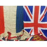 A collection of assorted flags including the Union Jack and the Tricolore, plus a pair of brown