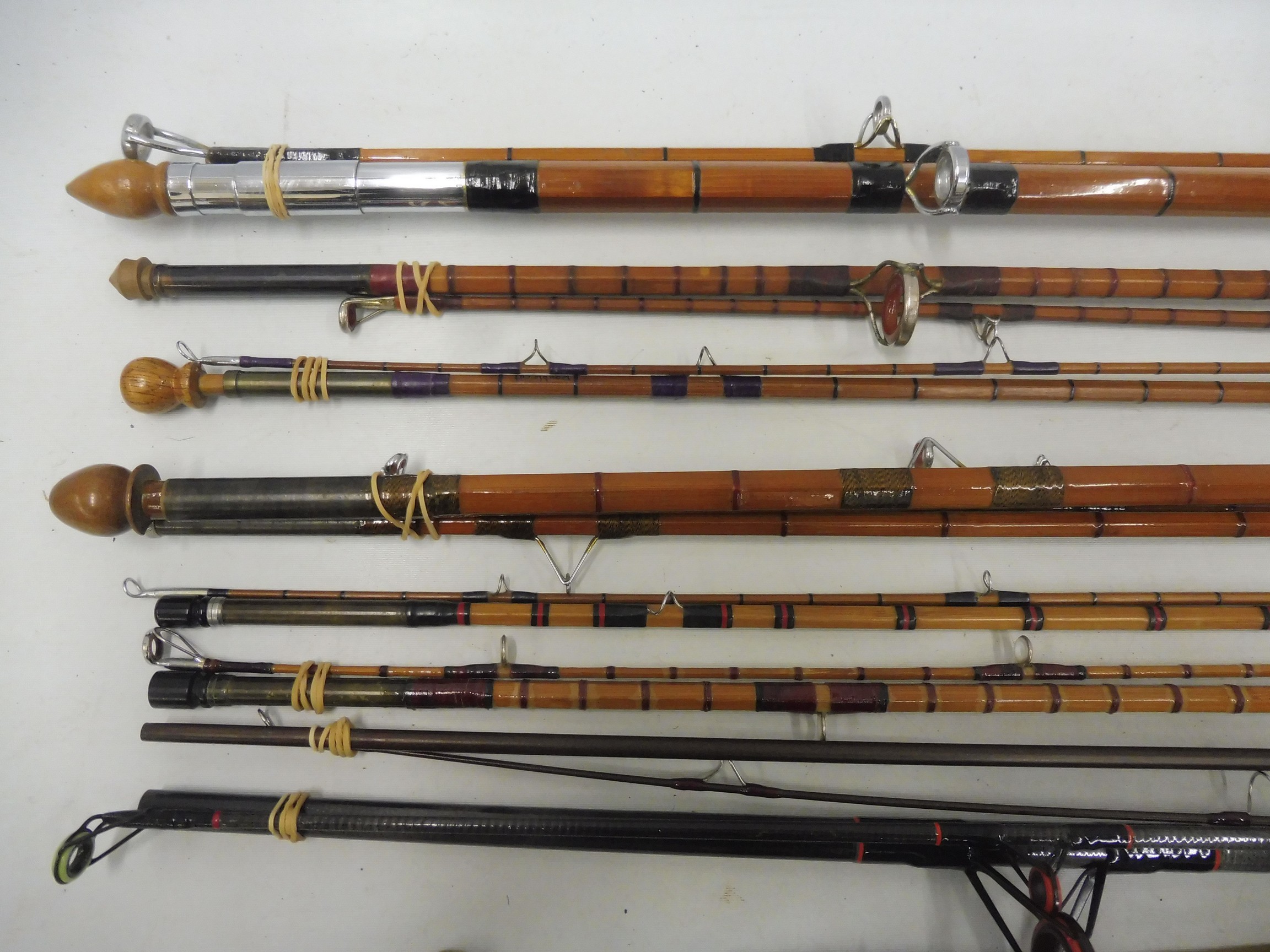 A collection of split cane fishing rods including a Sealey Octopus, a Seaford Beach Caster, a 1979