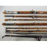 A collection of split cane fishing rods including a Sealey Octopus, a Seaford Beach Caster, a 1979