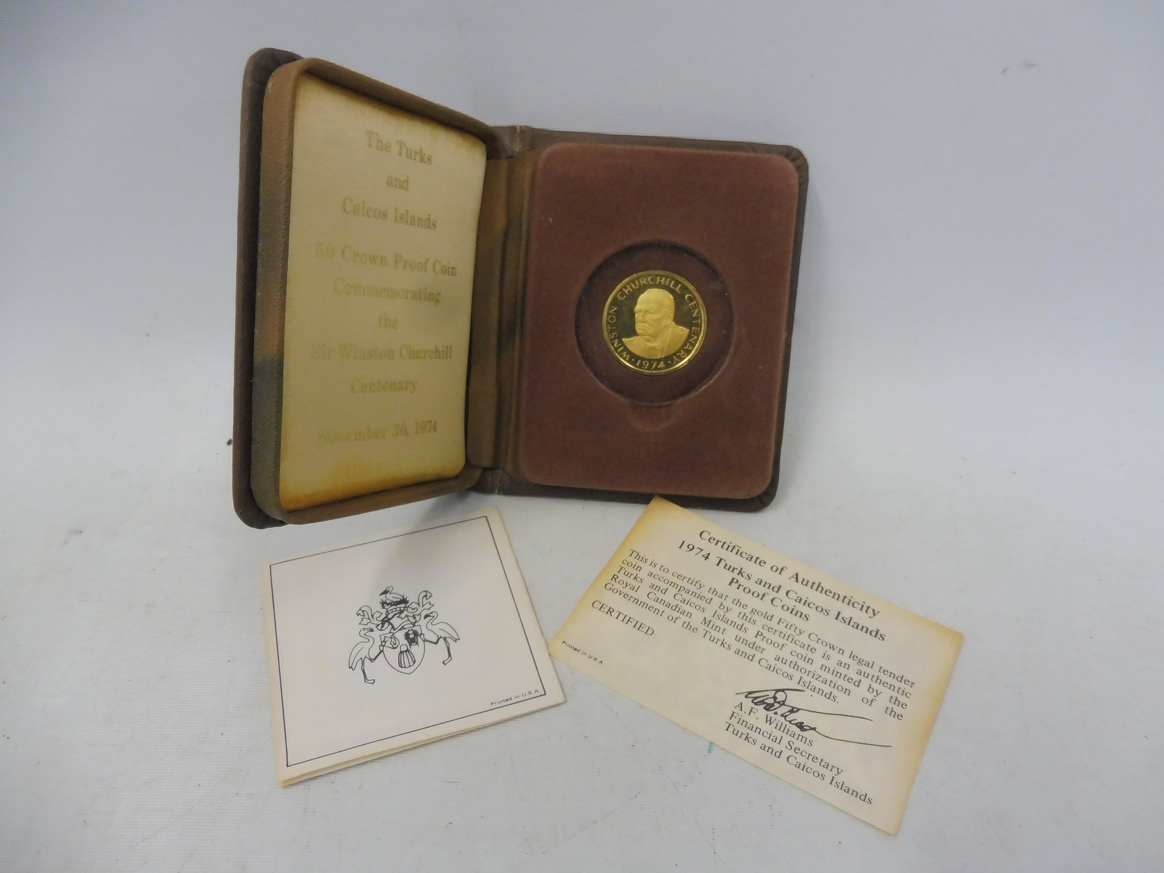 A cased 1974 Turks and Caicos Islands Churchill gold fifty crown proof coin, with certificate and
