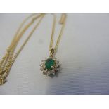 A cased 9ct gold diamond and green stoned pendant, approx.4.5g.