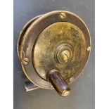 A James Ogden of Cheltenham 2 3/4" centre pin brass fishing reel.