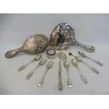 An Art Nouveau silver backed dressing table mirror, a similar silver backed brush, a silver vesta