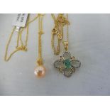 A flower-shaped emerald pendant, gold on silver on a silver chain plus a Chinese pearl pendant