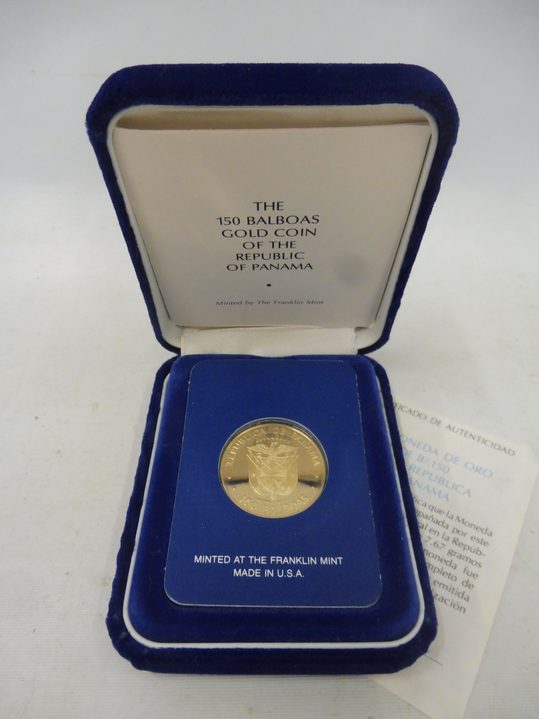 A cased 1980 Franklin Mint Republic of Panama 150 Balboas gold proof coin, with certificate.