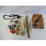 A quantity of assorted costume jewellery including a coral necklace, watches etc.