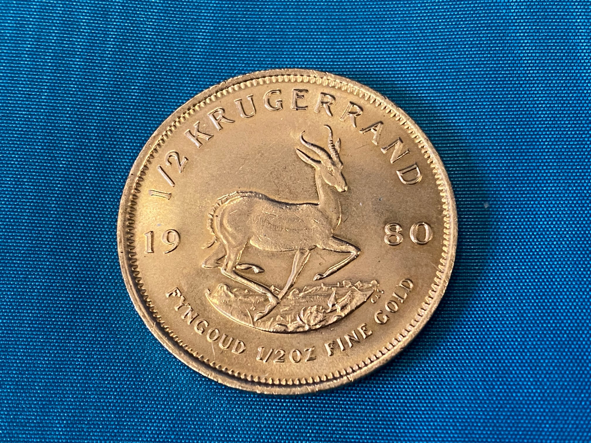 A 1980 1/2 gold krugerrand.