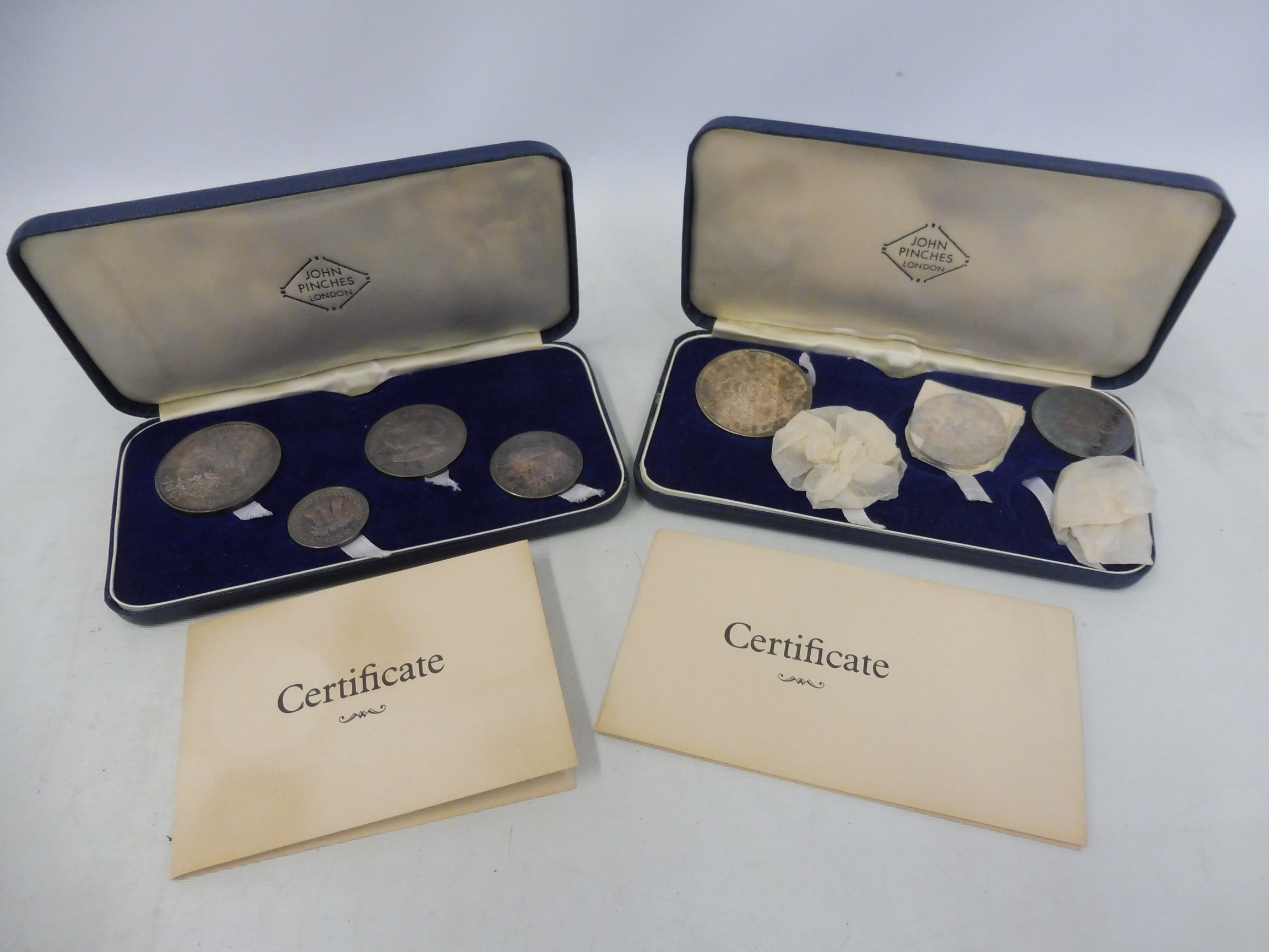 Two cased sets of Britannia silver, each containing four Chester Investiture 1969 coins.