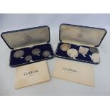 Two cased sets of Britannia silver, each containing four Chester Investiture 1969 coins.